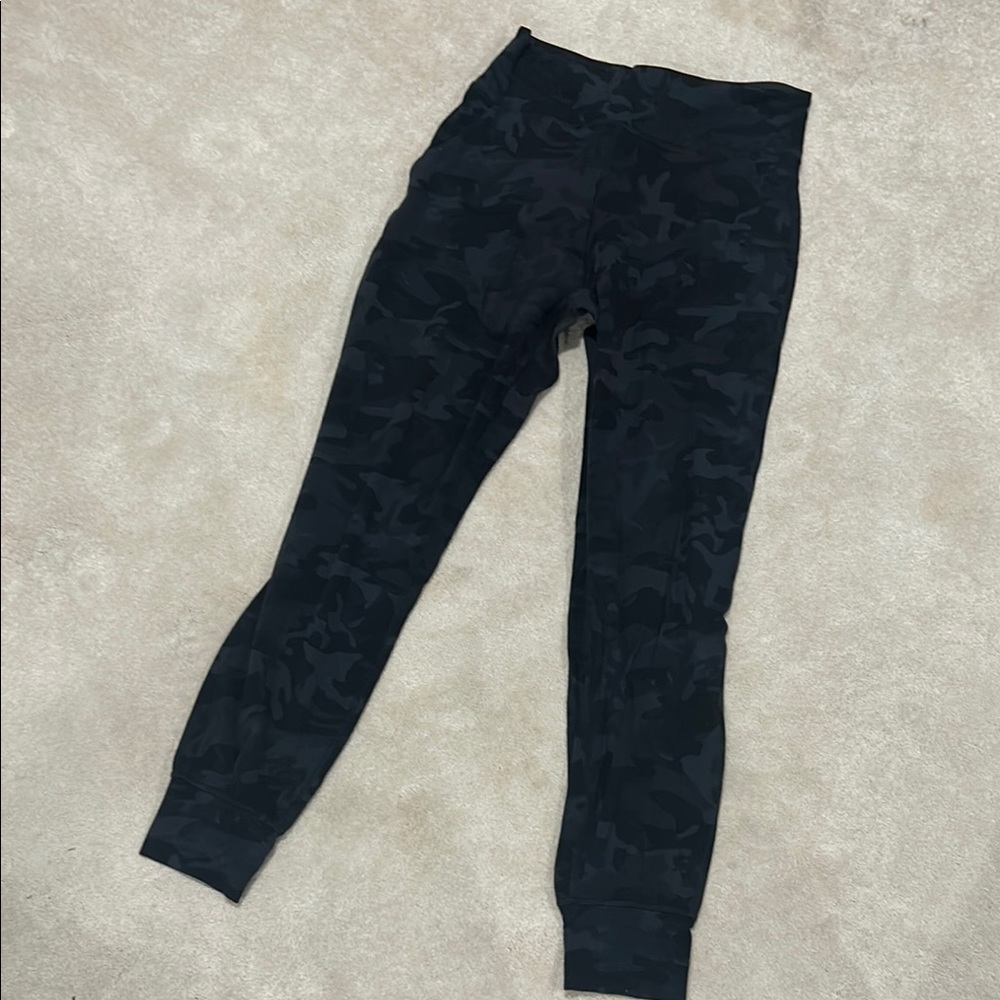 Black camouflage joggers with pockets. excellent condition.